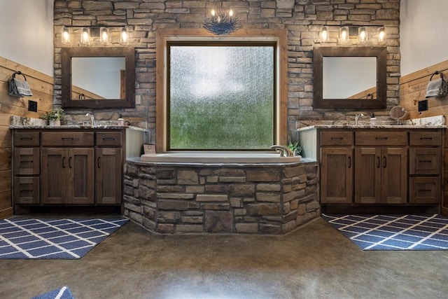 bathroom featuring vanity and a tub