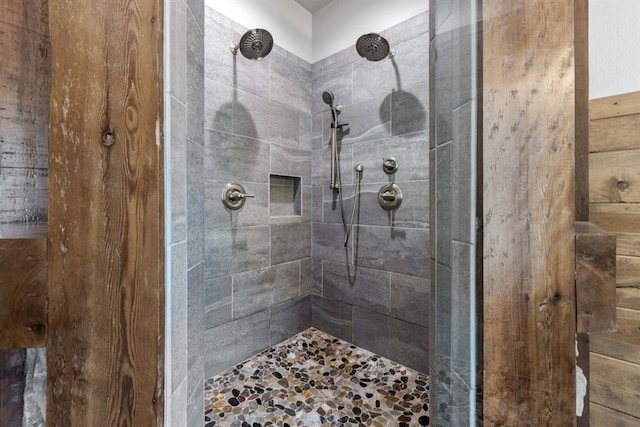 bathroom with a tile shower