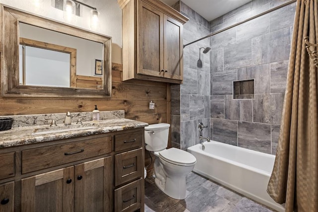 full bathroom with shower / bath combination with curtain, toilet, and vanity