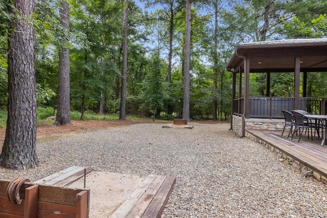 view of yard with a wooden deck