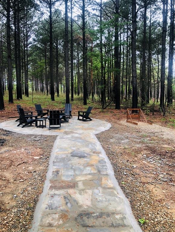 view of home's community with a fire pit