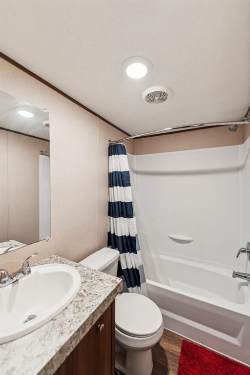 full bathroom with shower / bath combination with curtain, vanity, toilet, and hardwood / wood-style floors