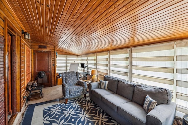 sunroom featuring lofted ceiling and wood ceiling