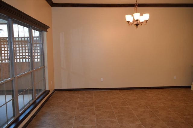 tiled empty room featuring ornamental molding and a notable chandelier