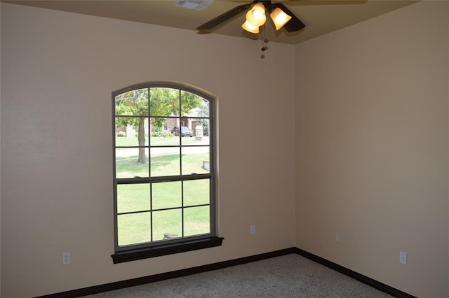 unfurnished room featuring carpet floors and ceiling fan