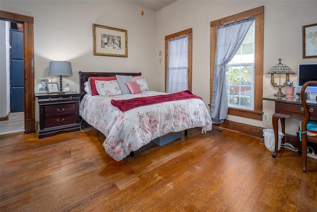 bedroom with hardwood / wood-style flooring