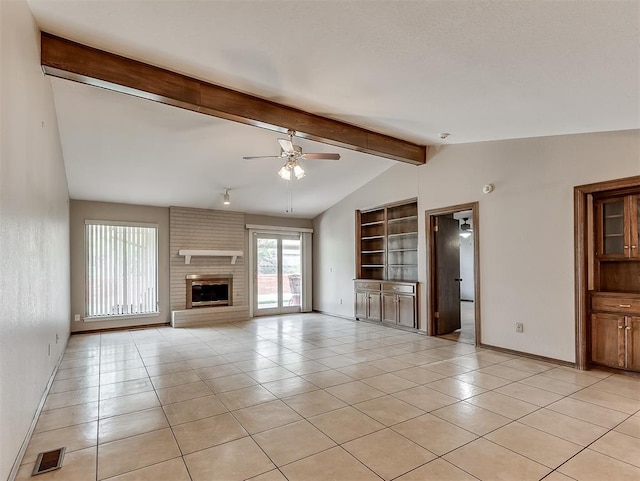 unfurnished living room with vaulted ceiling with beams, ceiling fan, built in shelves, and light tile patterned flooring