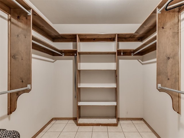 walk in closet featuring light tile patterned floors