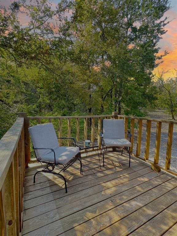 988 Ridge Point Rd, Fort Towson, OK 74735 - view of deck at dusk