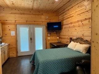 988 Ridge Point Rd, Fort Towson, OK 74735 - bedroom with wood ceiling, dark wood-style floors, and wooden walls