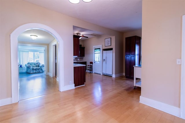 hallway with light wood-type flooring