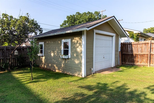 garage featuring a yard