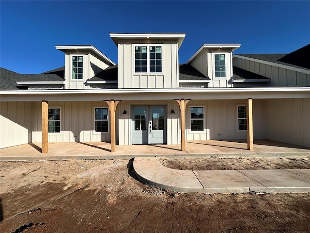 view of front facade featuring french doors and a patio