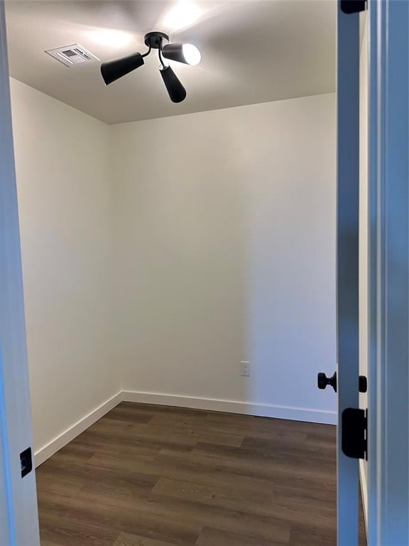 unfurnished room featuring ceiling fan and dark hardwood / wood-style floors