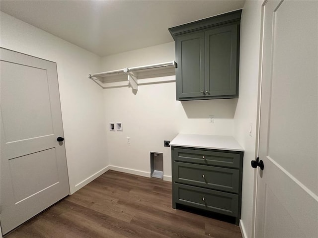 laundry area with cabinets, electric dryer hookup, dark hardwood / wood-style floors, and washer hookup