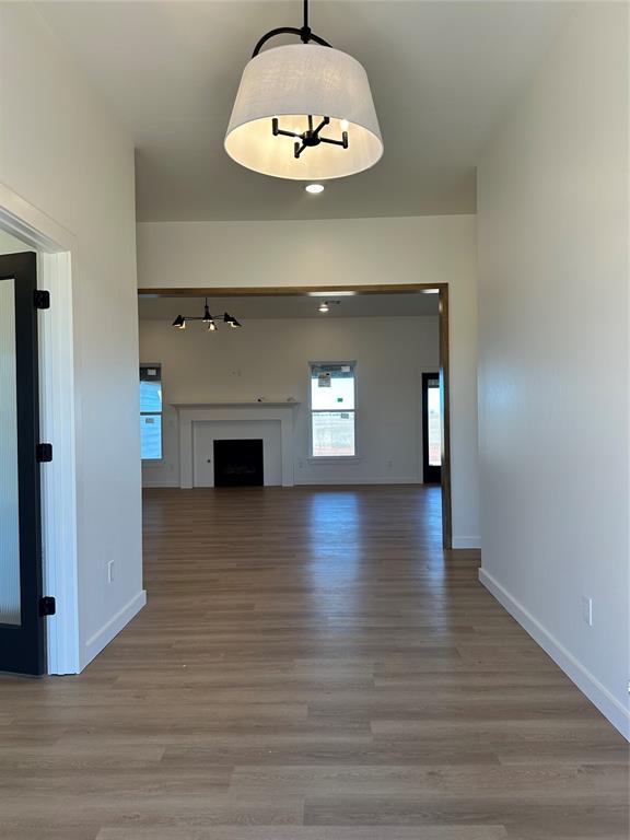 unfurnished living room featuring light hardwood / wood-style flooring