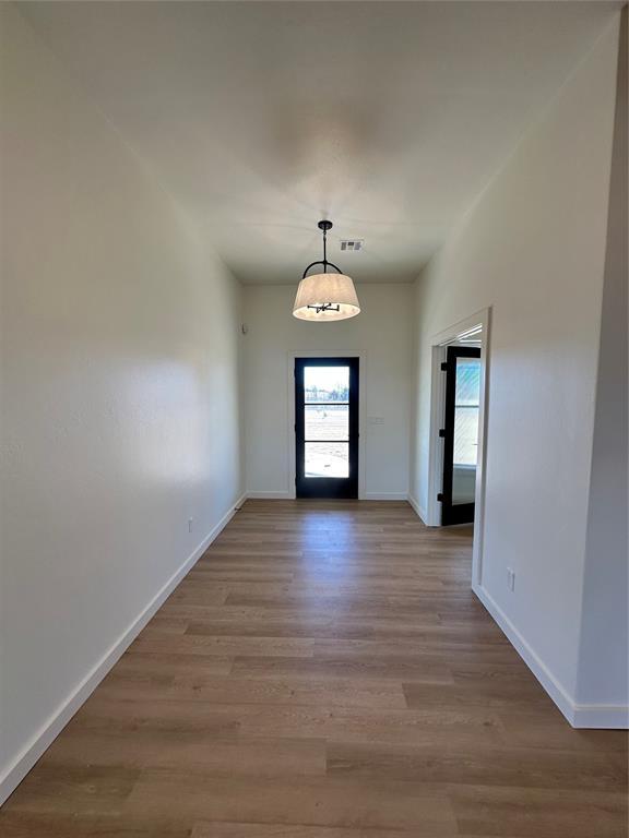 doorway to outside featuring light hardwood / wood-style floors