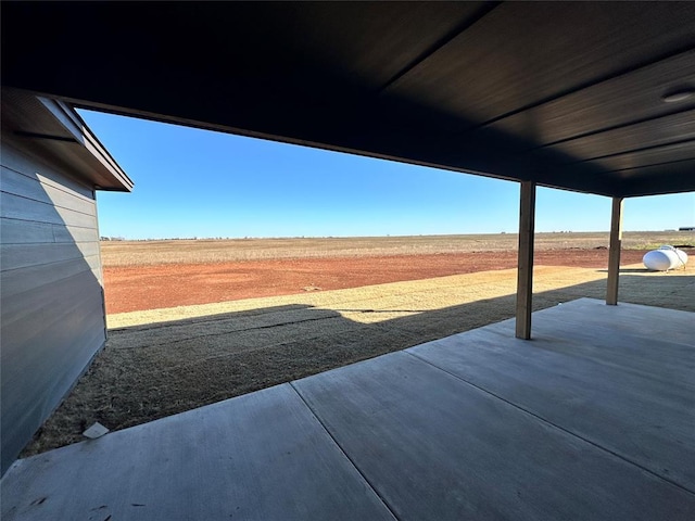 view of patio / terrace featuring a rural view