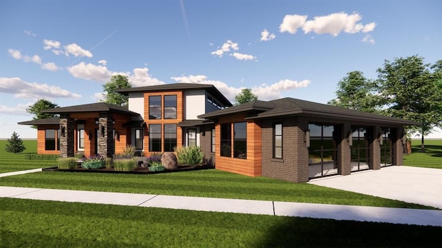 view of front of property featuring a patio area, a front yard, and brick siding