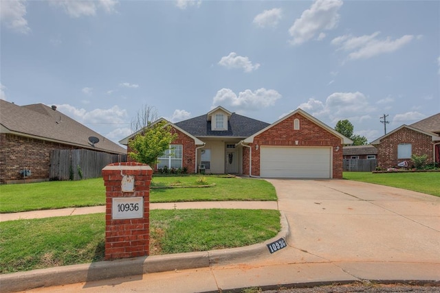 view of front facade featuring a garage and a front yard