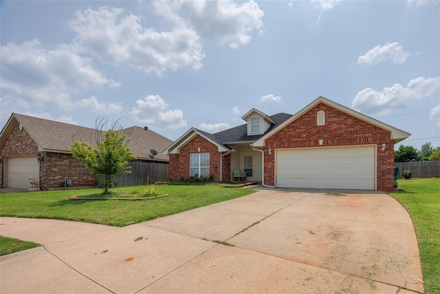 view of front of home featuring a garage and a front lawn