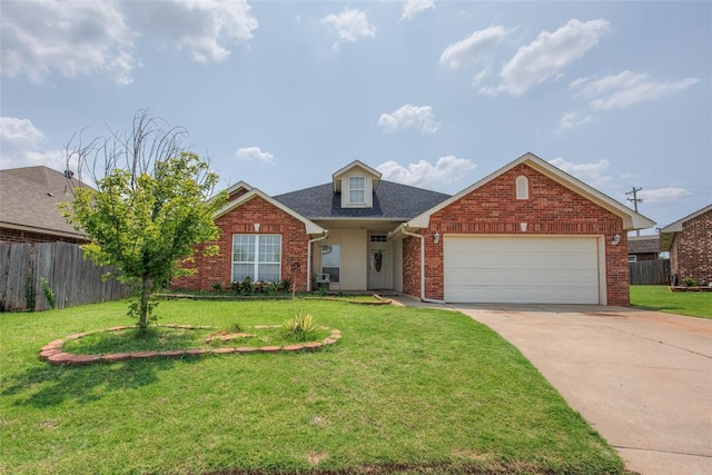 view of front of property featuring a garage and a front lawn