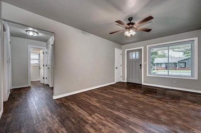 entryway with ceiling fan and dark wood-type flooring