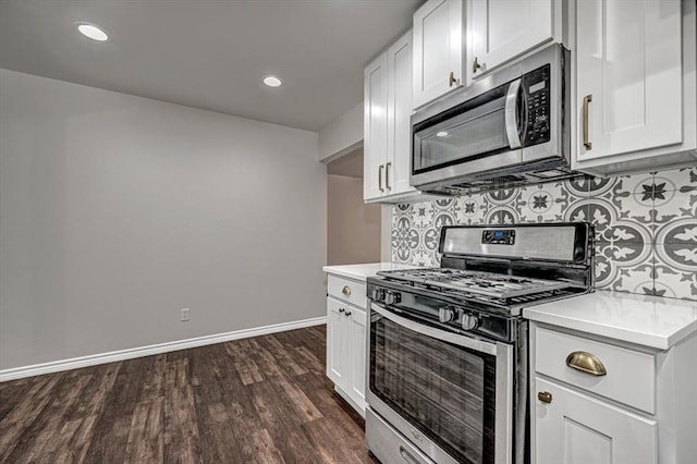 kitchen with decorative backsplash, white cabinets, dark hardwood / wood-style floors, and appliances with stainless steel finishes