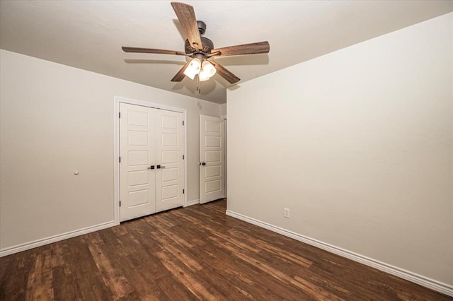 unfurnished bedroom featuring dark hardwood / wood-style flooring and ceiling fan