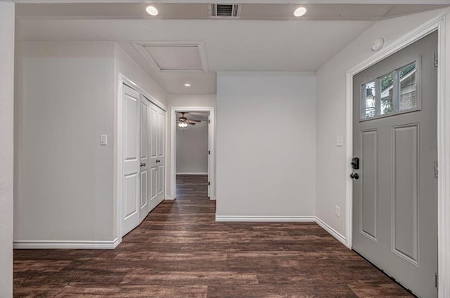 foyer featuring ceiling fan and dark wood-type flooring