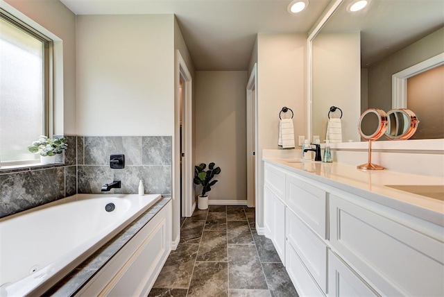 bathroom featuring vanity and a bathtub