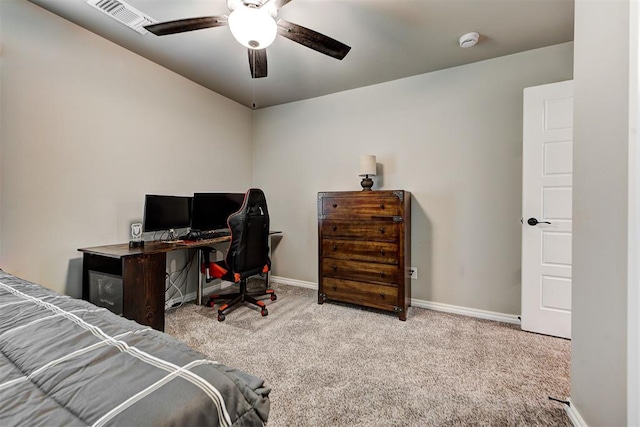 bedroom with ceiling fan and light carpet