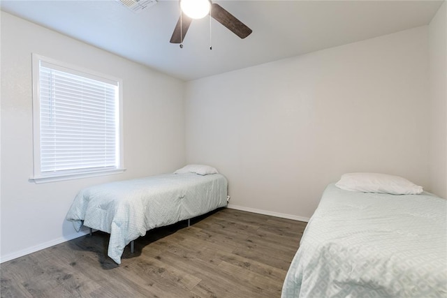 bedroom featuring ceiling fan and wood-type flooring