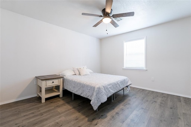 bedroom with hardwood / wood-style flooring and ceiling fan