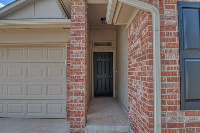 property entrance with a garage