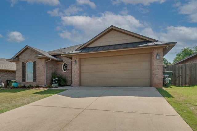 ranch-style home with a garage and a front lawn