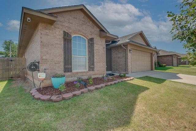 view of front facade with a garage and a front lawn