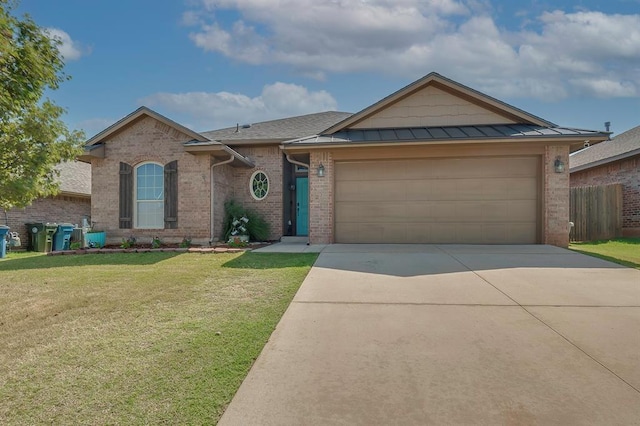 single story home featuring a garage and a front lawn