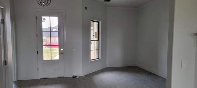 doorway to outside featuring dark hardwood / wood-style floors and an inviting chandelier