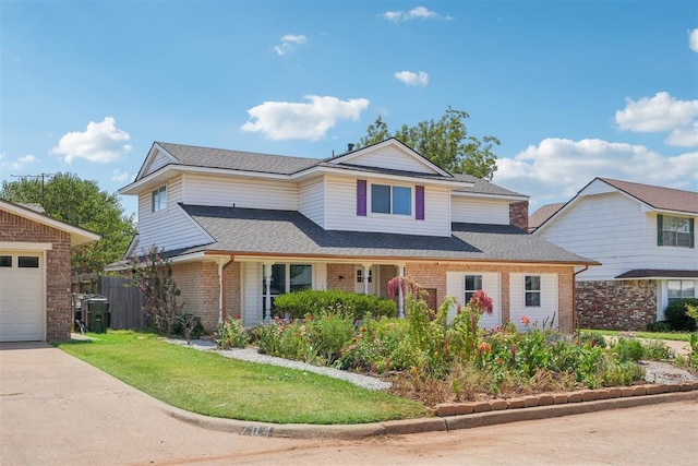 front of property with a front lawn and a garage