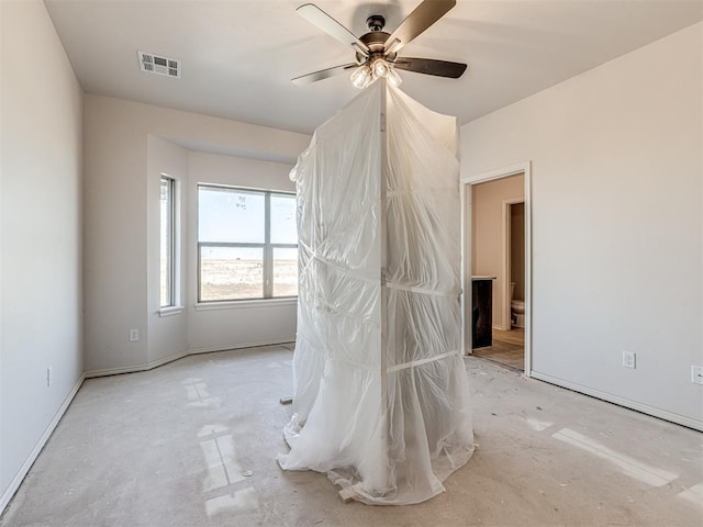 unfurnished bedroom with ceiling fan and ensuite bath