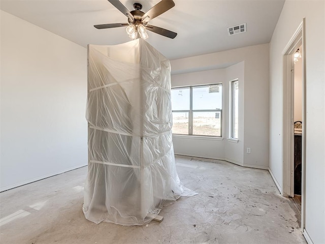 interior space with ceiling fan