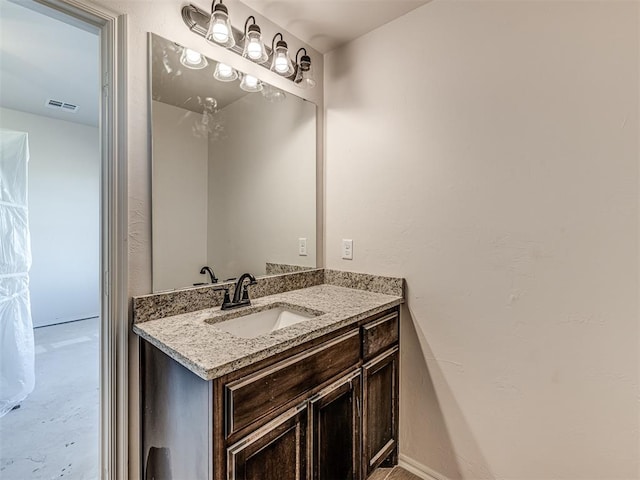 bathroom featuring vanity and concrete floors