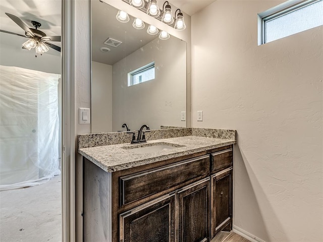 bathroom with vanity and ceiling fan