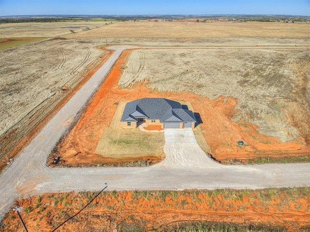 birds eye view of property with a rural view