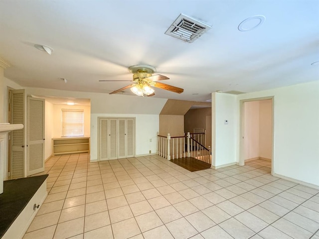 interior space featuring ceiling fan and light tile patterned floors