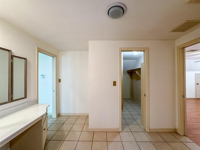 hallway with light tile patterned floors