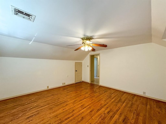 bonus room with hardwood / wood-style floors, ceiling fan, and lofted ceiling