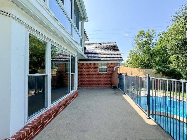 view of patio / terrace featuring a fenced in pool