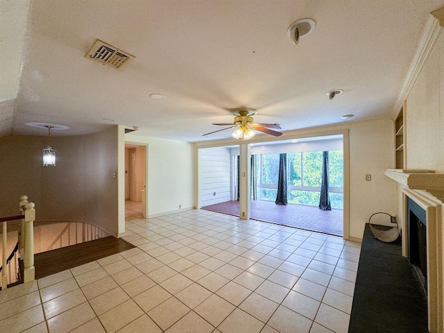 tiled living room featuring ceiling fan